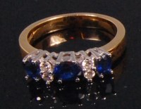 Lot 551 - A contemporary 18ct yellow gold sapphire and...