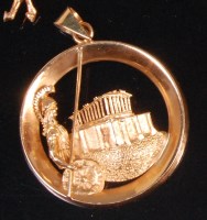 Lot 566 - A contemporary yellow gold Roman style pendant,...