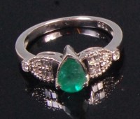 Lot 572 - A contemporary 18ct white gold emerald and...