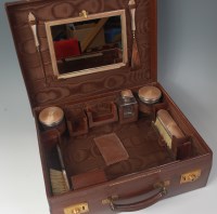 Lot 606 - A leather fitted travelling vanity case,...