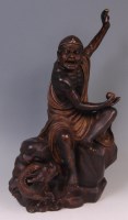 Lot 655 - A Chinese bronze figure of a seated Immortal,...