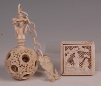 Lot 656 - A circa 1900 Chinese carved ivory puzzle ball,...