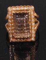 Lot 523 - A contemporary 18ct gold dress ring, set with...