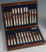 Lot 89 - An Art Deco cased set of 24 silver and mother...