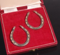 Lot 94 - A pair of 1960s cased silver napkin rings,...