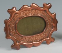 Lot 7 - An Arts & Crafts copper photograph frame, of...