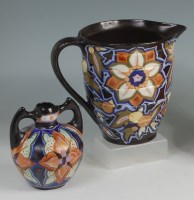 Lot 15 - A 1930s Crown Devon pottery single handled jug,...