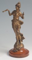 Lot 34 - An Art Nouveau gilded spelter figure of a full-...