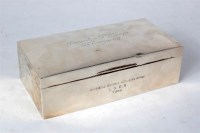 Lot 18 - A solid silver presentation cigarette box...