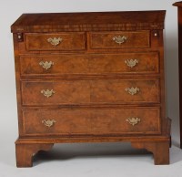 Lot 974 - A walnut and figured walnut bachelors chest,...