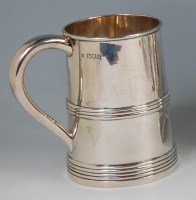 Lot 556 - A late Victorian silver tankard, in the early...