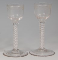 Lot 519 - A pair of mid-18th century wine glasses, each...