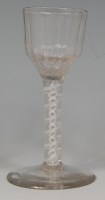Lot 523 - An 18th century wine glass, the ogee ribbed...