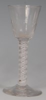 Lot 525 - A mid-18th century pedestal wine glass, the...