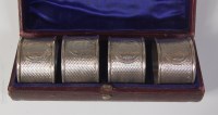 Lot 598 - A cased set of four Victorian silver napkin...