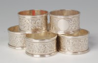 Lot 602 - A set of four Edwardian silver napkin rings,...