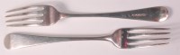 Lot 606 - A set of six late Georgian silver table forks,...