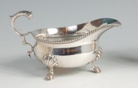 Lot 611 - An Edwardian silver gravy boat, in the...