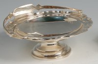 Lot 623 - A George V silver pedestal cake basket, having...