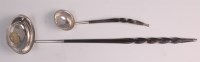 Lot 636 - A George III silver toddy ladle, set with a...