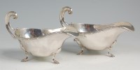 Lot 640 - A pair of silver gravy boats, each having...