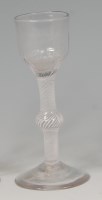 Lot 516 - A mid-18th century wine glass, the ogee fluted...