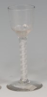 Lot 518 - A mid-18th century wine glass, the ogee bowl...