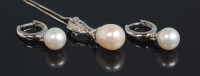 Lot 677 - A modern 14ct white gold pearl and diamond set...