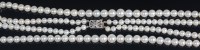 Lot 678 - A graduated cultured pearl double string...