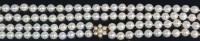 Lot 679 - A cultured and knotted pearl double string...