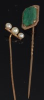 Lot 710 - A yellow gold and jade set tie-pin, having...