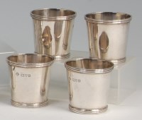 Lot 643 - A set of four George V silver spirit measures,...