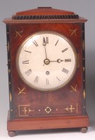 Lot 884 - A late Regency mahogany and brass inlaid...