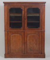 Lot 956 - A Victorian figured walnut bookcase cabinet,...