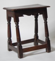 Lot 981 - An 18th century oak joint stool, the top...