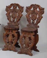 Lot 984 - A pair of 18th century carved walnut hall...