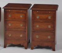 Lot 1020 - A pair of mahogany three drawer bedside chests,...