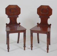 Lot 1021 - A pair of late Regency mahogany hall chairs,...