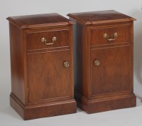 Lot 1039 - A pair of walnut bedside cabinets, each having...