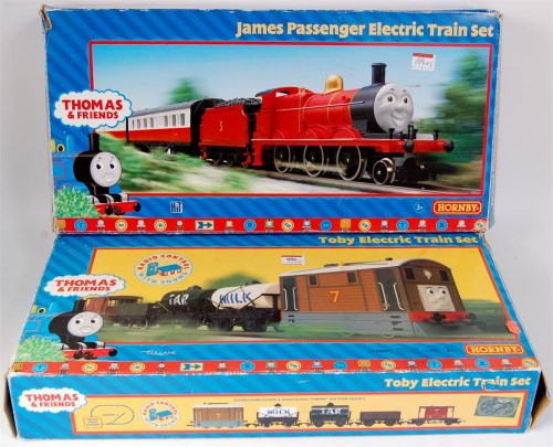 Lot 886 - Hornby Toby and James train sets in poor boxes,...