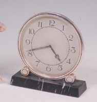Lot 14 - A French Art Deco silver plated mantel clock,...