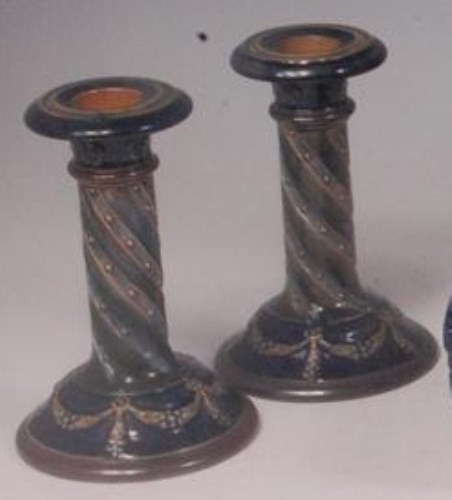 Lot 75 - A pair of Royal Doulton stoneware candlesticks,...