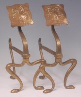 Lot 83 - A pair of Arts & Crafts brass andirons, of all-...