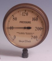 Lot 110 - A 1930s brass circular pressure gauge, the...