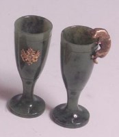 Lot 158 - A pair of Russian spinach jade and silver gilt...