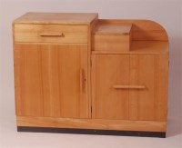 Lot 247 - An Art Deco birch sideboard, of stepped form,...