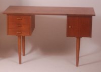 Lot 280 - A 1960s Danish teak kneehole writing desk,...