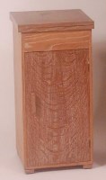 Lot 291 - An Art Deco limed oak single door bedside...