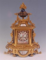 Lot 672 - A 19th century French ormolu and porcelain...