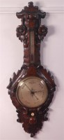 Lot 677 - A late Victorian heavily carved oak two dial...